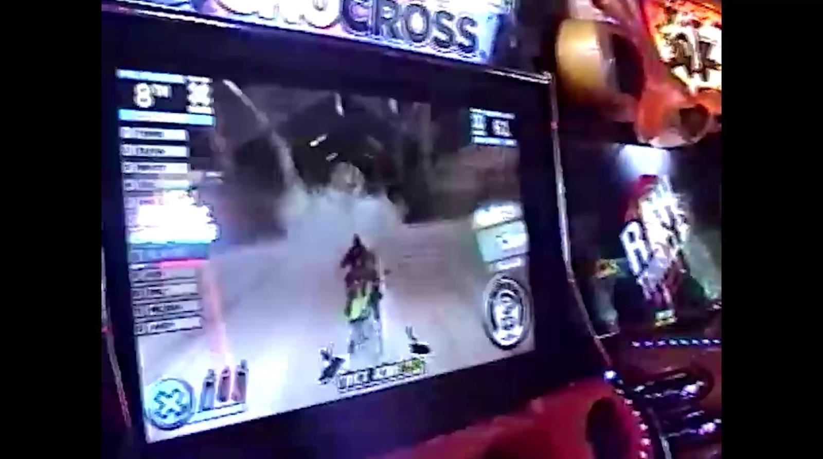 a person playing a video game on a large screen
