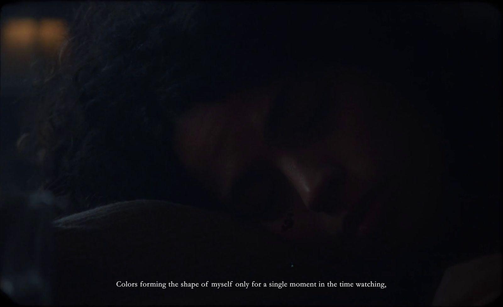 a woman is sleeping in the dark with her eyes closed