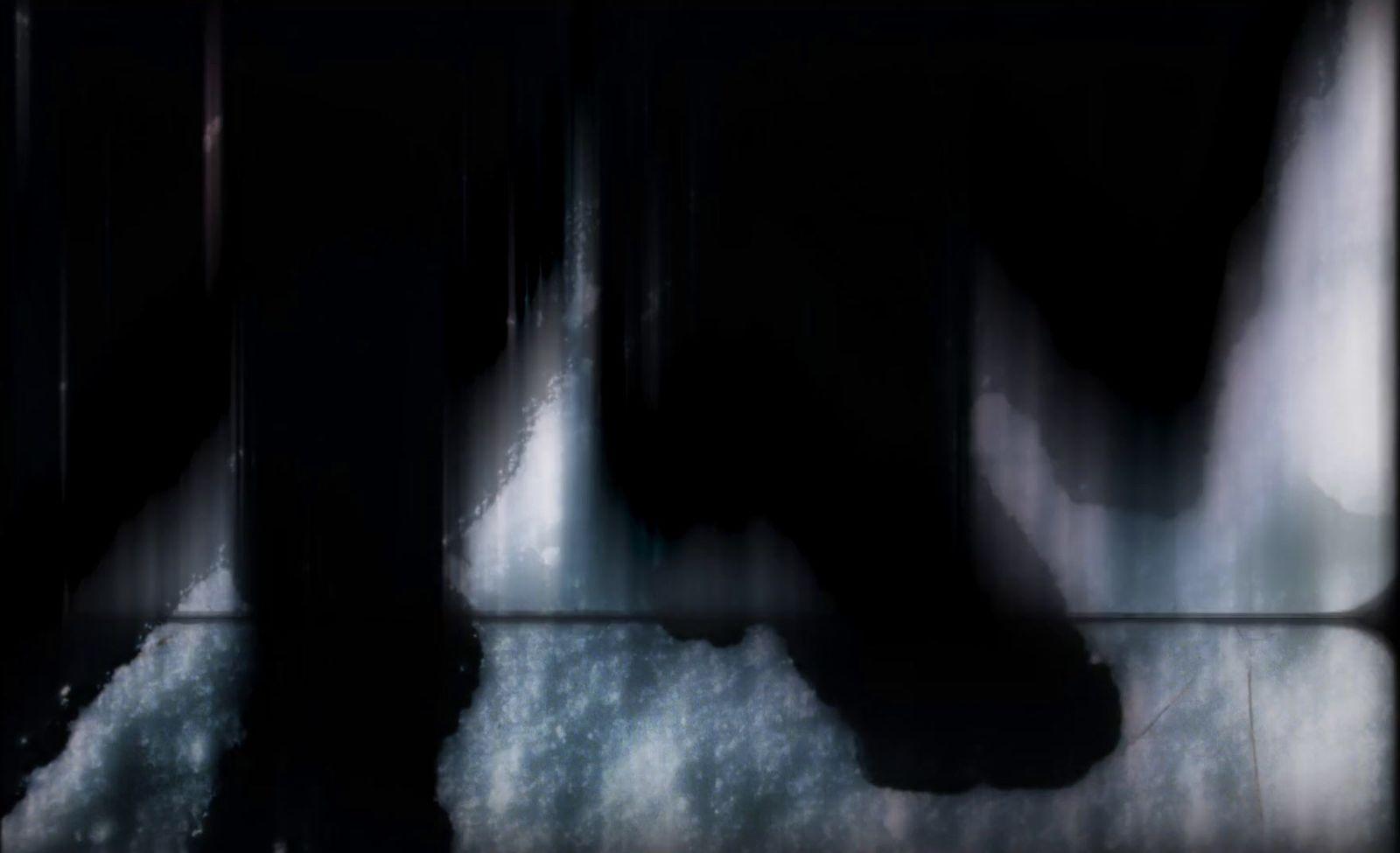 a blurry image of a person walking in the dark