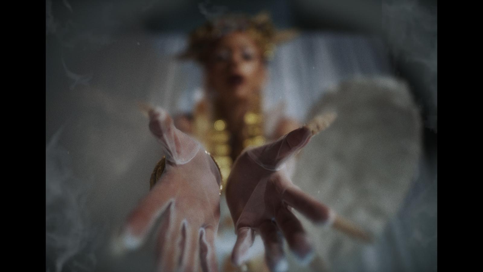 a blurry photo of a woman with angel wings