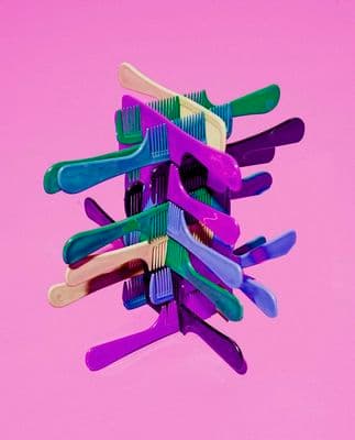 a bunch of toothbrushes stacked on top of each other