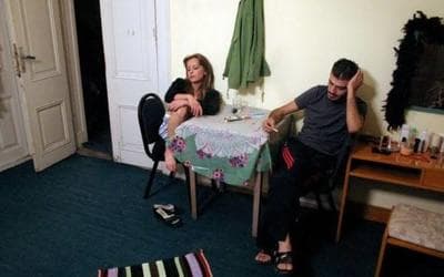 a man and a woman sitting at a table