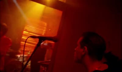 a man standing in front of a microphone