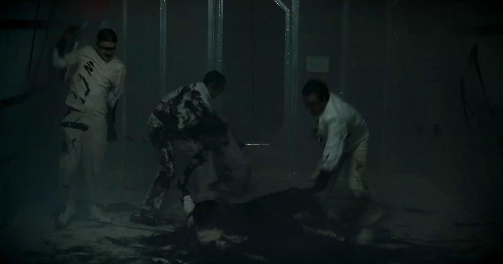 a group of people in a dark room