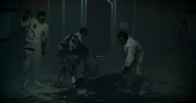 a group of people in a dark room