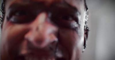 a blurry photo of a man making a face