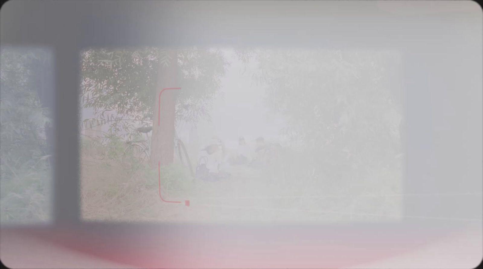 a blurry photo of a window with trees in the background