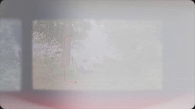 a blurry photo of a window with trees in the background