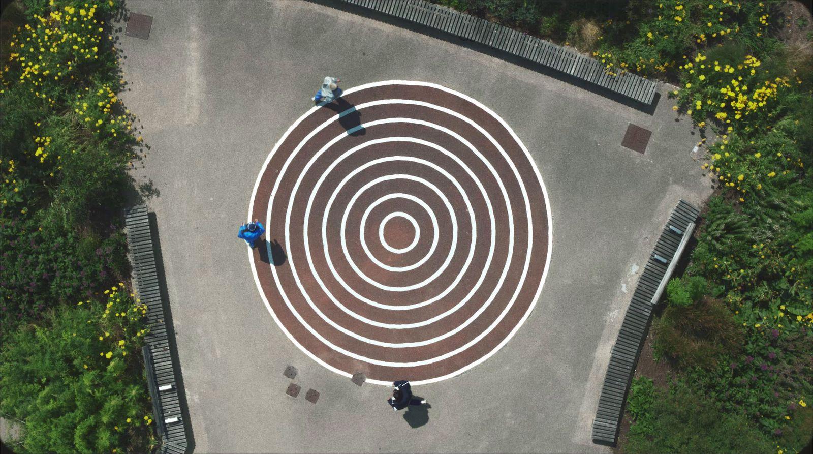 an aerial view of a park with a circular design