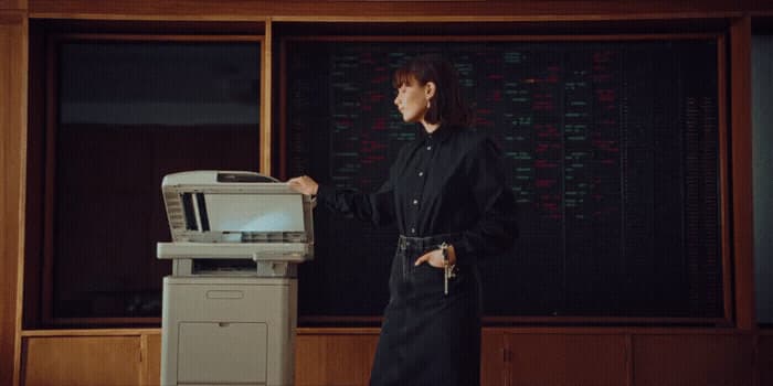 a woman standing in front of a machine