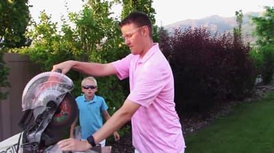 a man putting something in a baby carriage