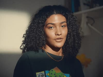 a close up of a person wearing a black shirt