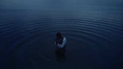 a person standing in a body of water