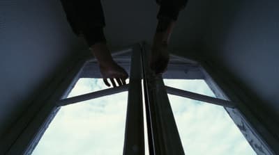 a person standing in front of a window