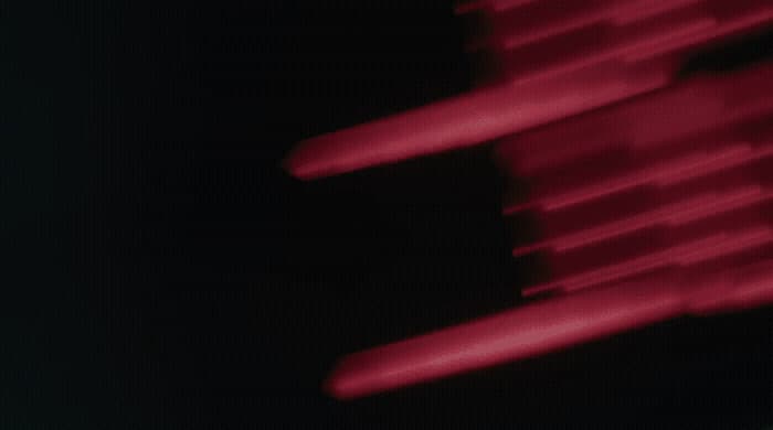 a blurry photo of a red object in the dark