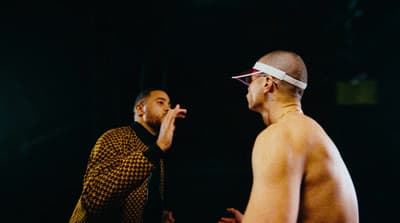 a couple of men standing next to each other