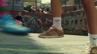 a person riding a skateboard in a skate park