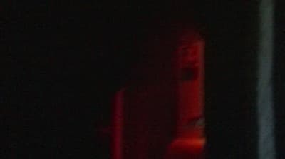 a blurry photo of a red light in the dark