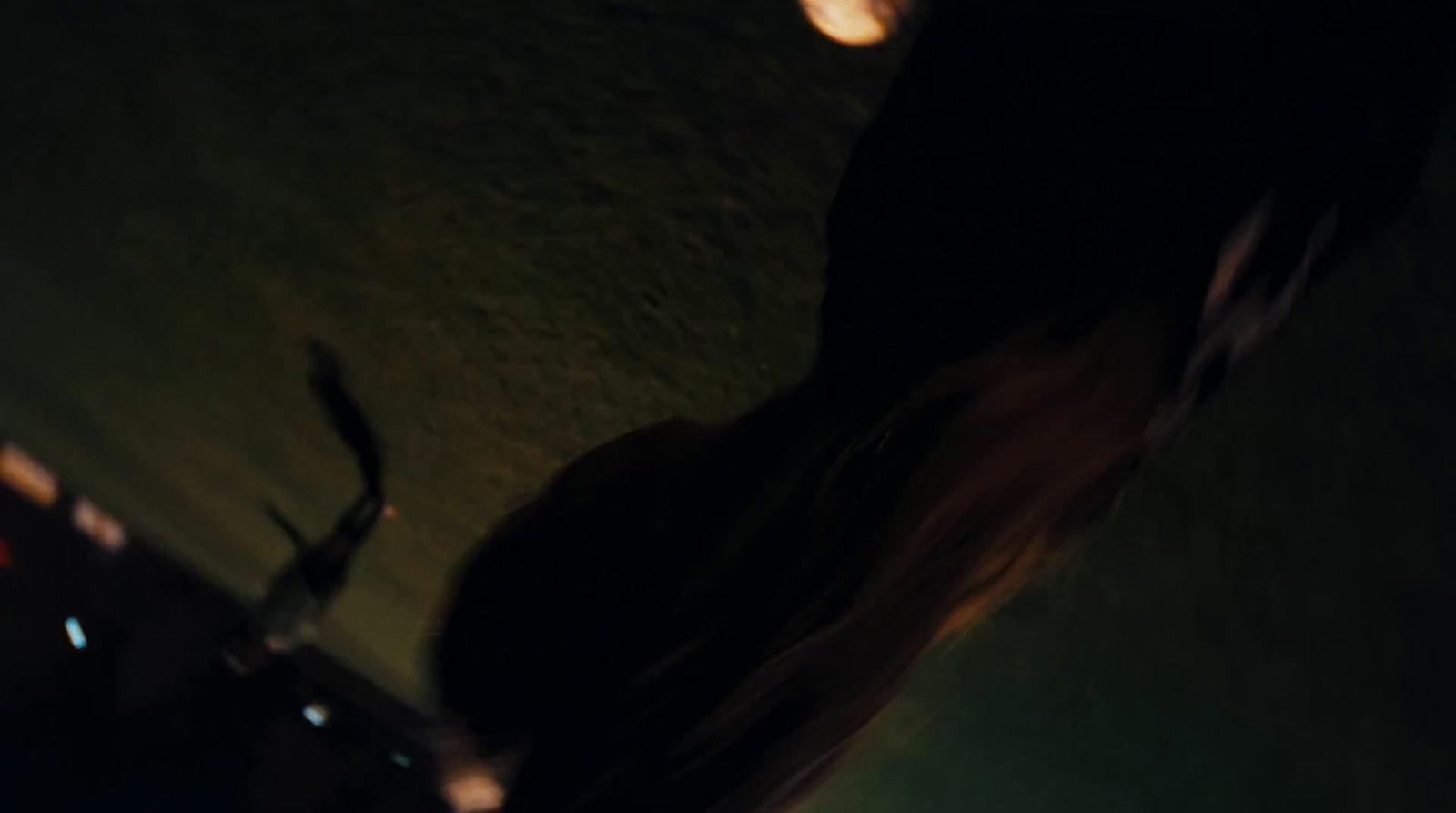 a blurry photo of a person holding a cell phone