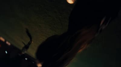 a blurry photo of a person holding a cell phone