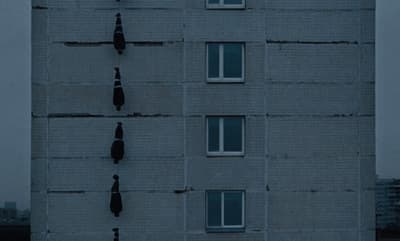 a tall building with a clock on the side of it