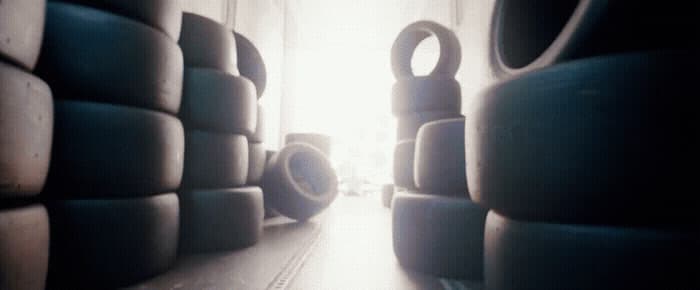 a room filled with lots of tires next to a window
