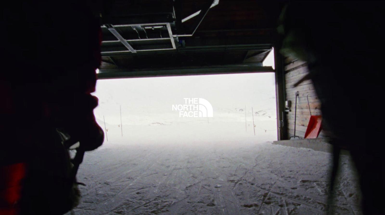 the north face logo is seen through an open door