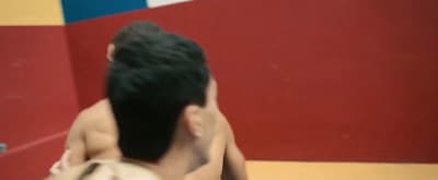 a man holding a cell phone up to his ear