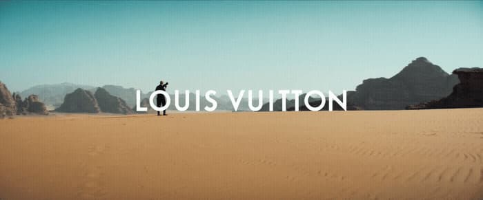 a person standing in the middle of a desert