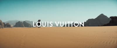 a person standing in the middle of a desert