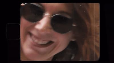 a close up of a person wearing sunglasses
