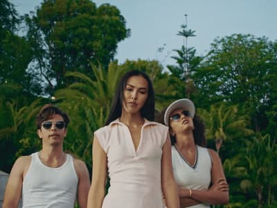 a group of three women standing next to each other
