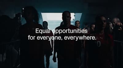 a group of people walking down a hallway