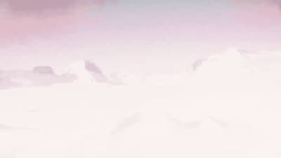 a snowboarder is going down a snowy hill