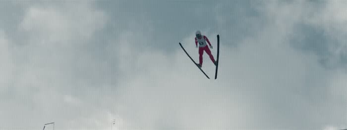 a pair of skis flying through the air
