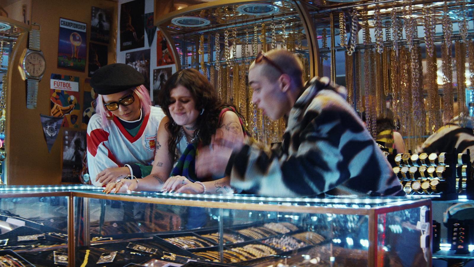 a group of people sitting at a counter in a store