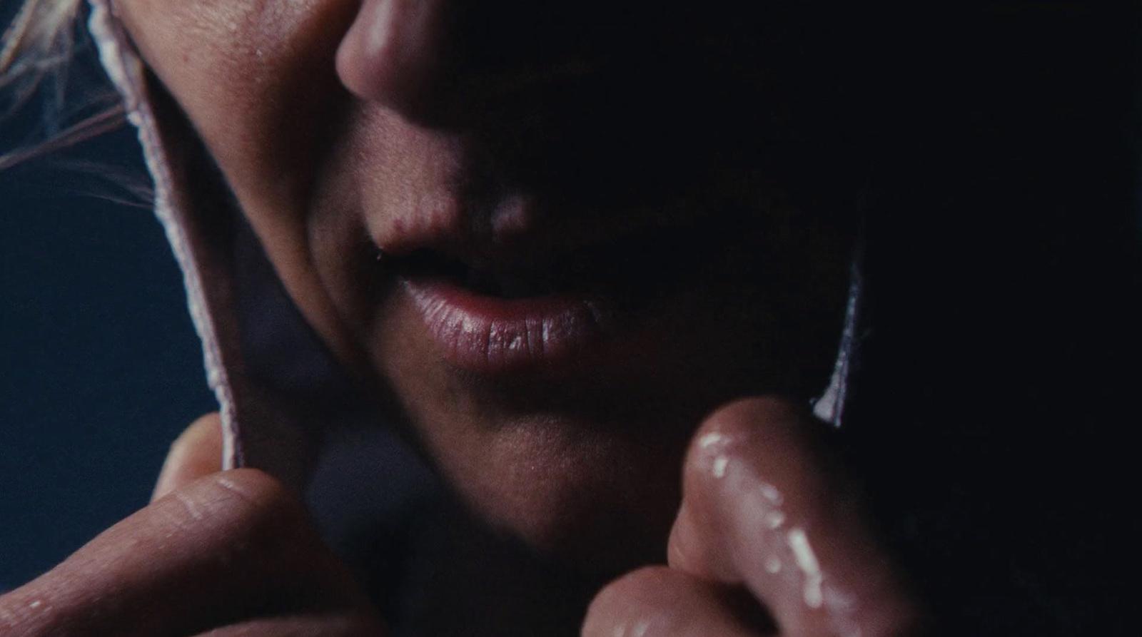a close up of a person talking on a cell phone