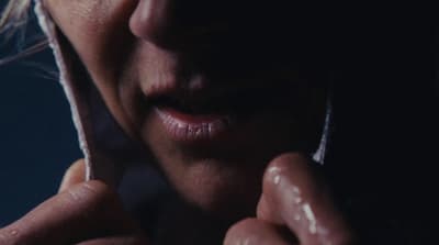 a close up of a person talking on a cell phone