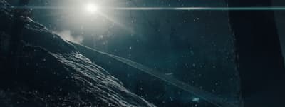 a snow covered mountain under a bright light