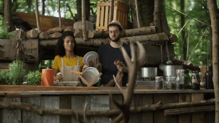 a man and a woman standing in front of a counter
