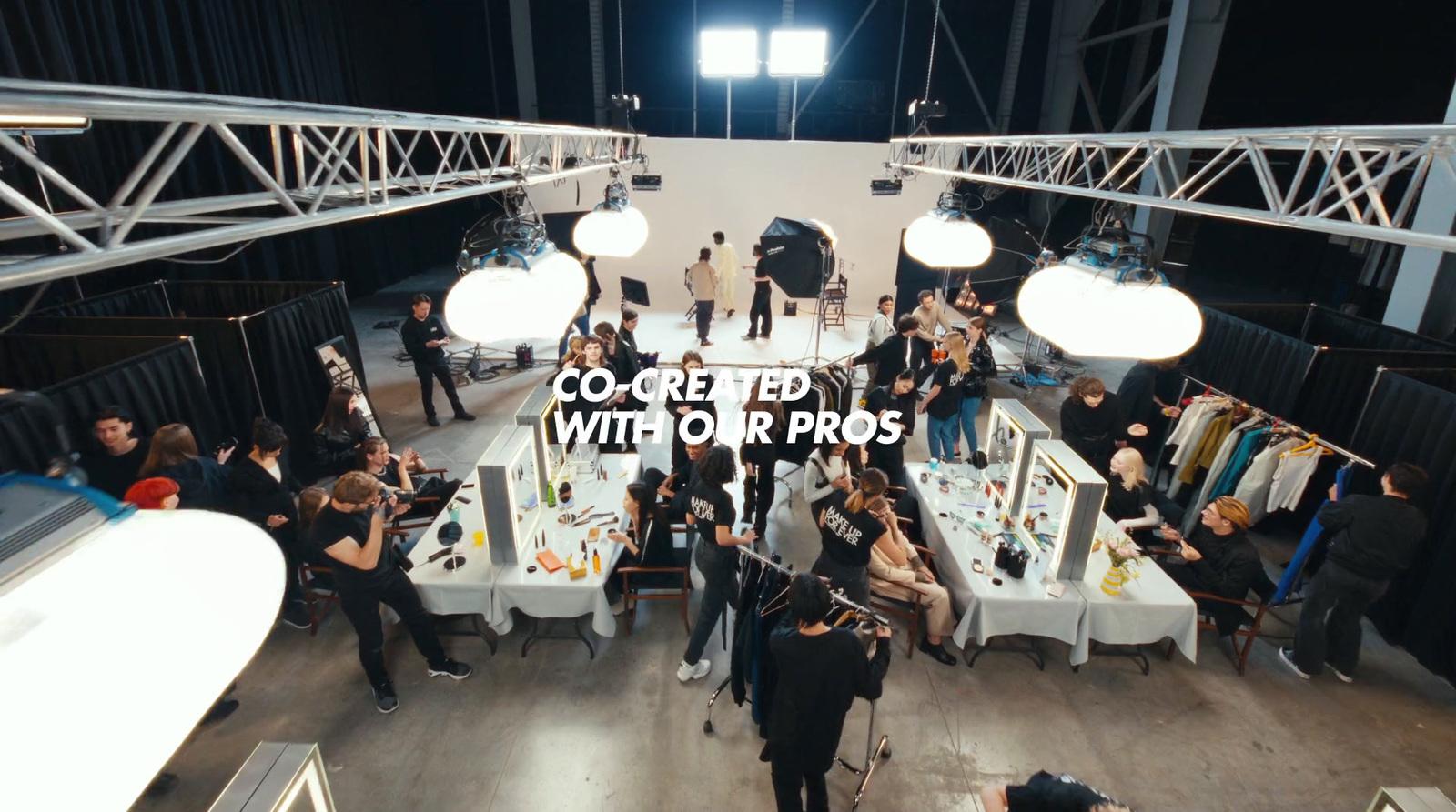 a group of people standing around a room