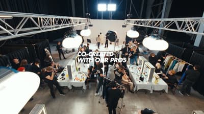 a group of people standing around a room