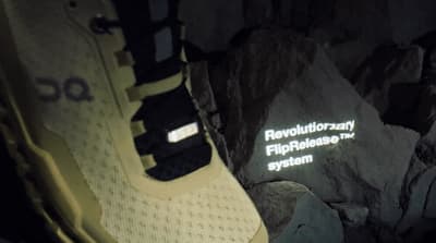 a close up of a pair of shoes on a rock