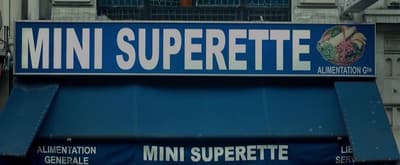 a blue sign that says mini superette on it