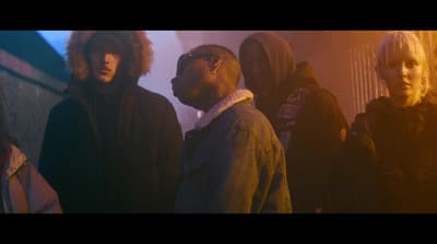 a group of young men standing next to each other