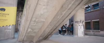 a group of people standing outside of a building