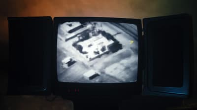 an old tv sitting on top of a wooden table