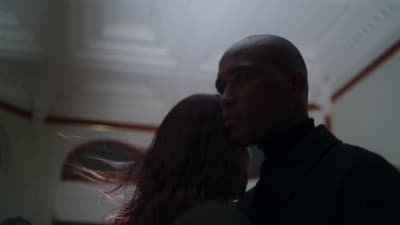 a man and a woman standing in a room