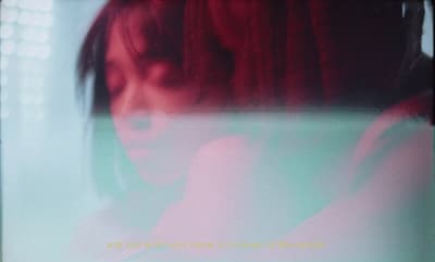 a blurry photo of a woman with red hair