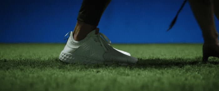 a close up of a person's feet in grass